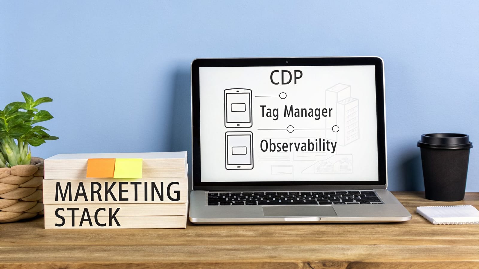 Laptop displaying CDP, Tag Manager, and Observability, beside a plant and books labeled 'Marketing Stack'.