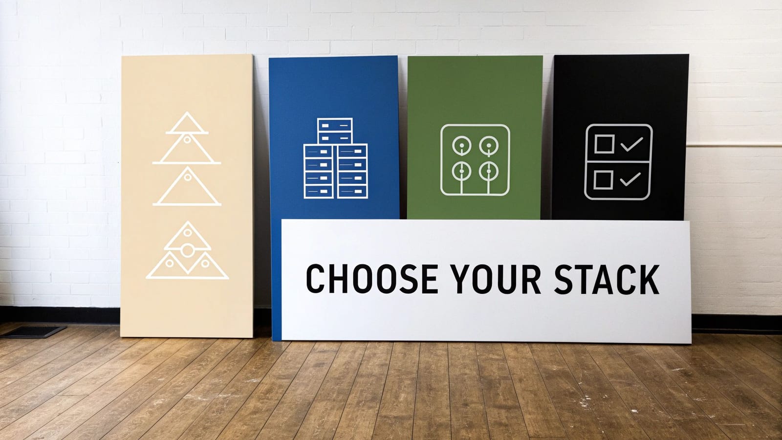 Four colored panels with abstract icons representing technology stacks, and a sign stating 'CHOOSE YOUR STACK' on a wooden floor.
